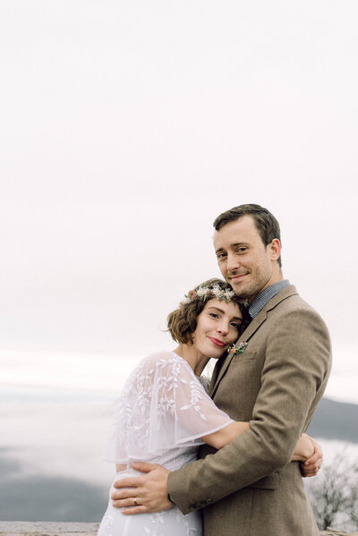 Couple standing together during their mountaintop elopement in Virginia, captured by Editorial Wedding Co.
