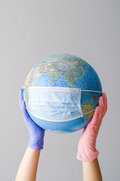 Photo of a globe wearing a mask