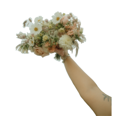 cutout of an arm holding up a bouquet