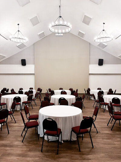 Wedding reception, banquet dinner, spacious seating, buffet style, chairs and tables, tablecloths