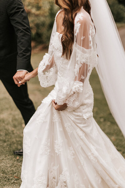 BRIDE-HOLDING-GOWN