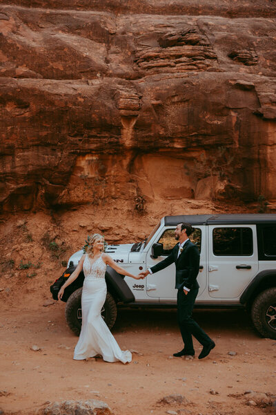 wedding rings on desert red rocks