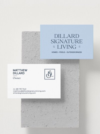 Double-sided business card design for Dillard Signature Living featuring serif logotype, contact info for owner Matthew Dillard, and monogram submark on soft textured background.
