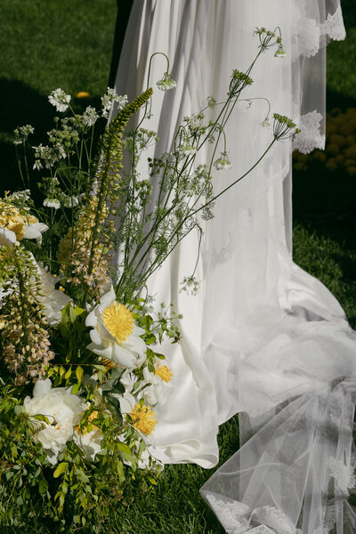 person kisses the cheek of their parter who is smiling sweetly