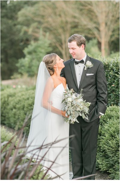 bride and groom smiling at each other during their moss mountain farm wedding