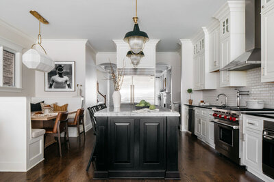 Bold cabinets and beautiful molding in kitchen design by Kira David Design