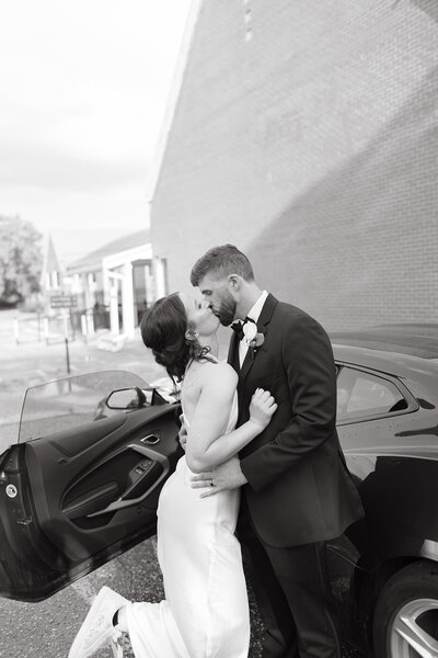 Bride and Groom kiss after their wedding ceremony in Wichita Kansas with Ashley Cole Photography