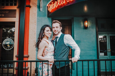 Outdoor baby portrait session in Winter Garden, Florida, with a child sitting in a metal bucket.