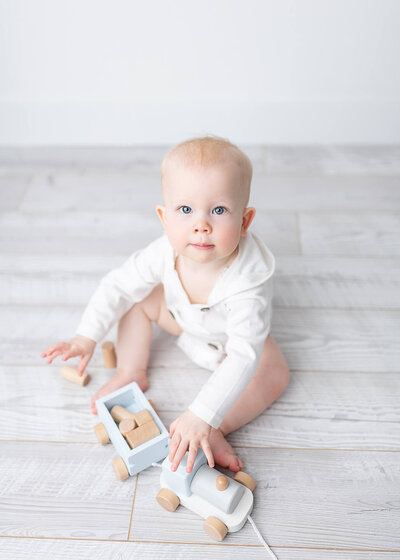 Medford Family Photography, baby boy playing with wooden toys