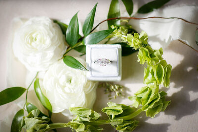 engagement ring detail photo with flowers