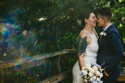 Creative Portrait of LGBTQ+ Couple kissing on Wedding Day