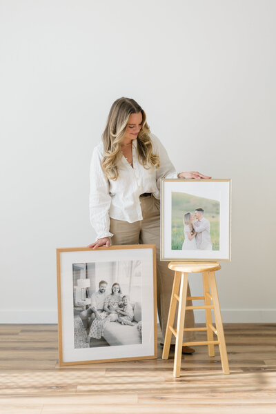 Amanda Shupe headshot with framed photos