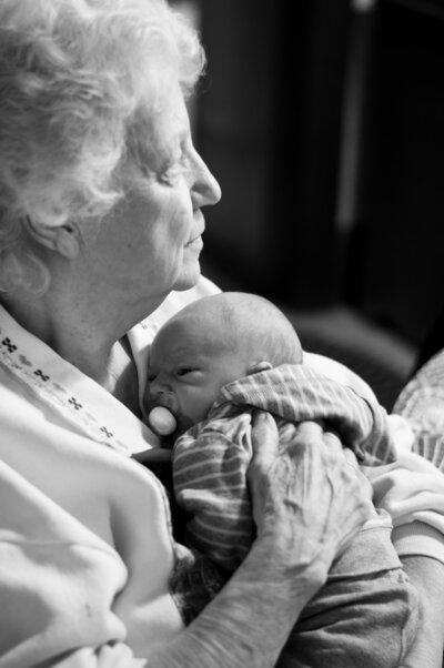 woman holding great grandson