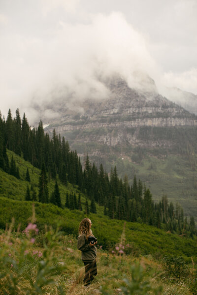 woman standing in the mountains