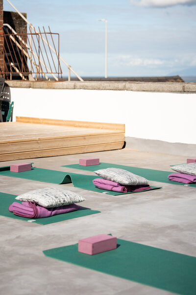 Rooftop yoga class with sea view
