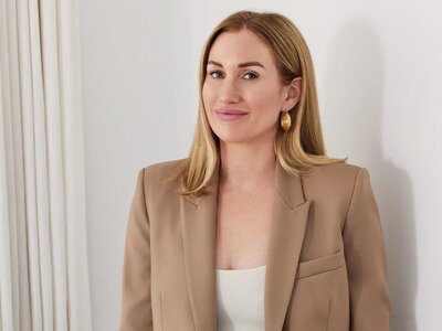 Blonde female founder smiling