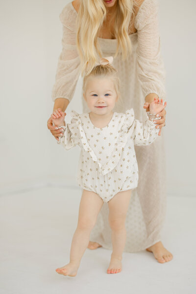 mom holding daughters hand at a downtown lodi studio photography session