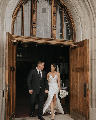 Bride and groom walk out of the church after their wedding ceremony.