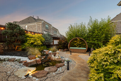 Zen-inspired backyard at 4521 Lakota Trail in Mansfield, listed by Haven Realty Group. Features peaceful landscaping, modern seating, and water feature.