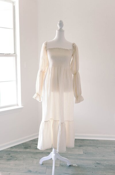 Women's white long sleeve dress.