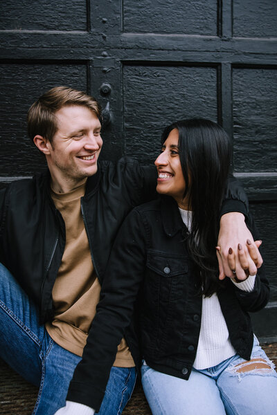 Bi-racial couple getting engagement photos in the strip district of Pittsburgh. 