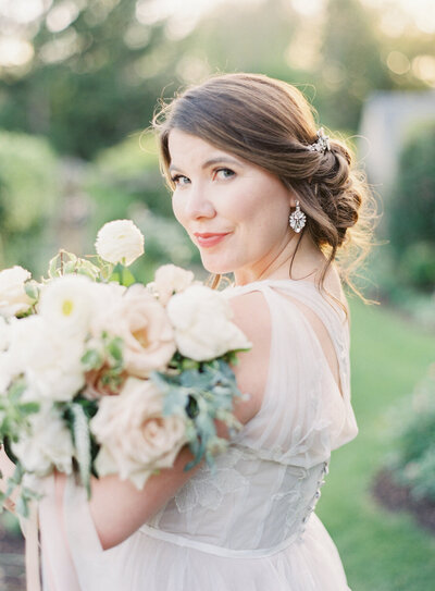 Bride smiling over her shoulder with her bouquet | Jeannine Lillie Events | Greencrest Manor | Anne Arbor Wedding Photographer | Pittsburgh Wedding Photographer | Anna Laero Photography
