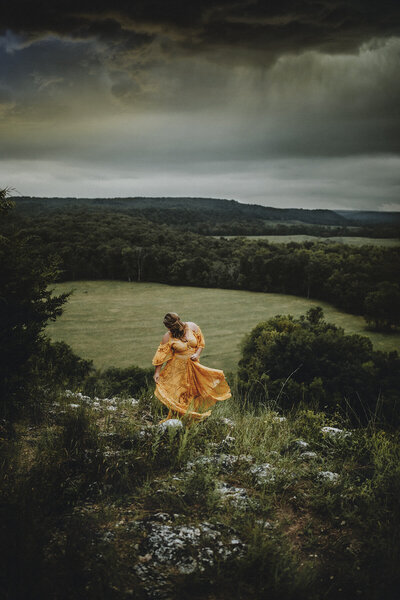 Amy Hodges dancing on a hilltop