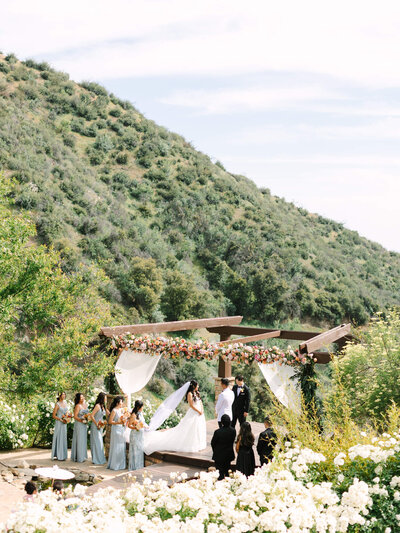 wide angle view of serendipity wedding venue ceremony with mountains in the background