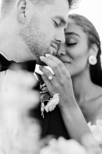 black and white bride and groom almost kissing