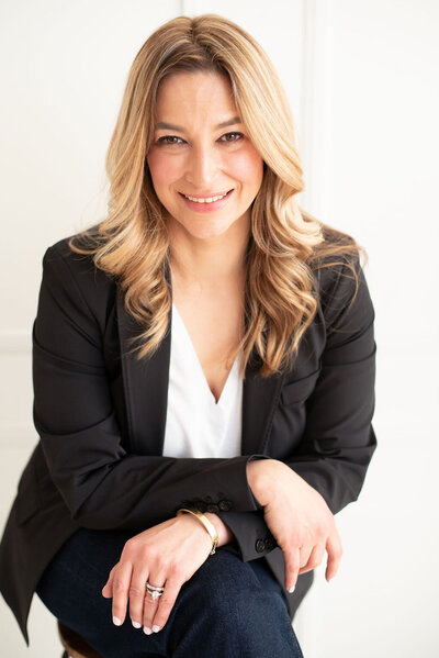 Headshot of Laura Gatsos Young smiling