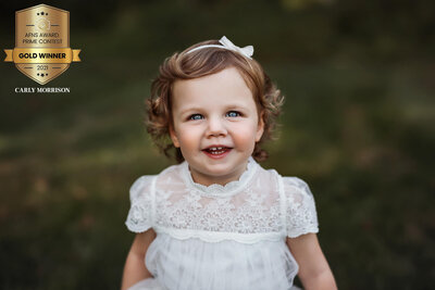 gold award  from the 2021 AFNS Prime Awards    photography competition badge  on winning  child  photo
