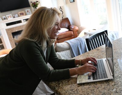 Marianne working from a laptop