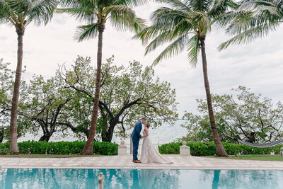 brideandgroomsmilingatthecamera