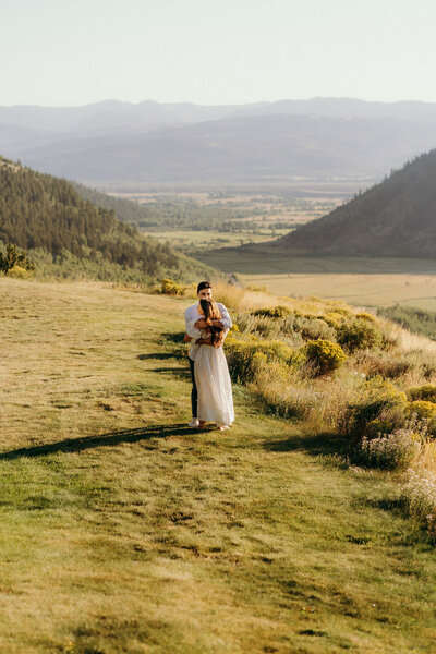 man and woman embracing in a field