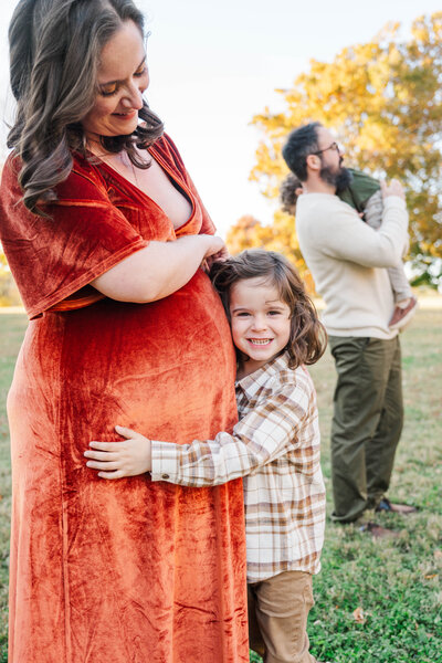 Engaged couple smiles during their engagement session at the Crescent Hill Reservoir
