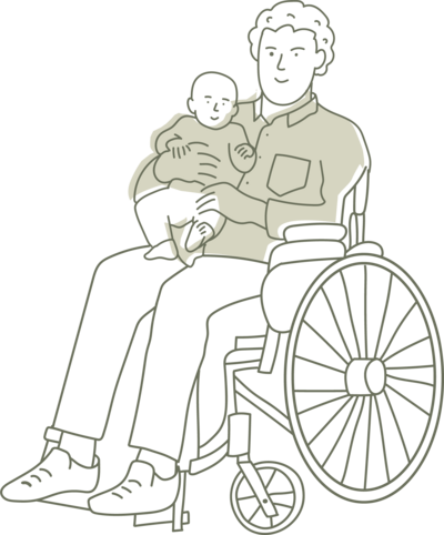 A parent holding their baby while sitting in wheelchair