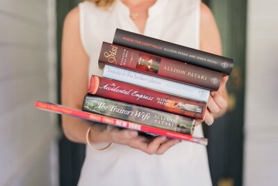Stack of books by author Allison Pataki