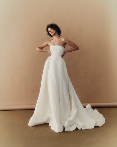 black and white image bride wearing feathered wedding dress