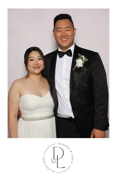 Couple pose together at their wedding reception 