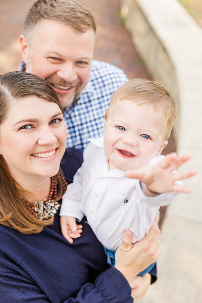 Smiling family with toddler in Wichita, KS