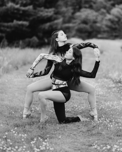 dancers doing a pose outside in field
