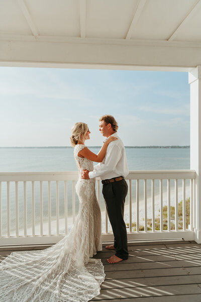 First look with bride and groom at their dream beach house on Navarre beach 