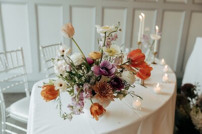 a wedding table floral arrangements styled by Yours Truly, a wedding planner and designer in New Jersey.