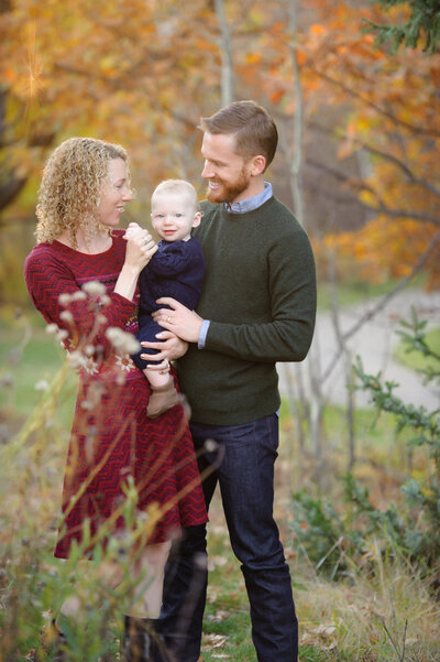 Famiy standing outside during fall family portraits with Boise photographer Tiffany Hix