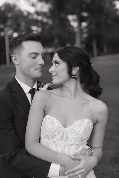 photo of bride and groom gently smiling at each other taken by Candid wedding photographer Milwaukee