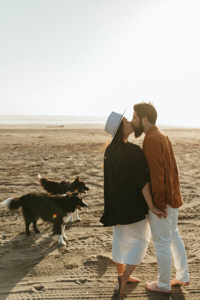 Blog post for engagement session at Pacific Beach, with couple and their dogs