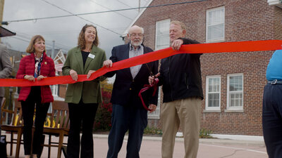 A ribbon cutting ceremony caputred by Jmetz Media.