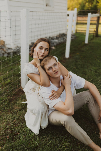 couple looking off into distance while holding each other close