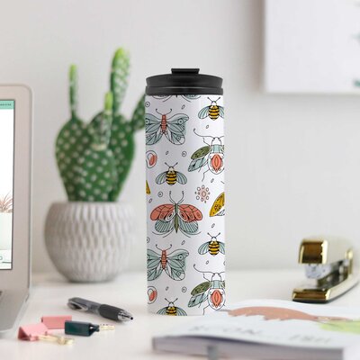 Tumbler for drinks that has a butterfly pattern all around the outside