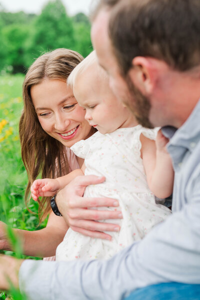 Kentucky couple smile at each other during their engagement session